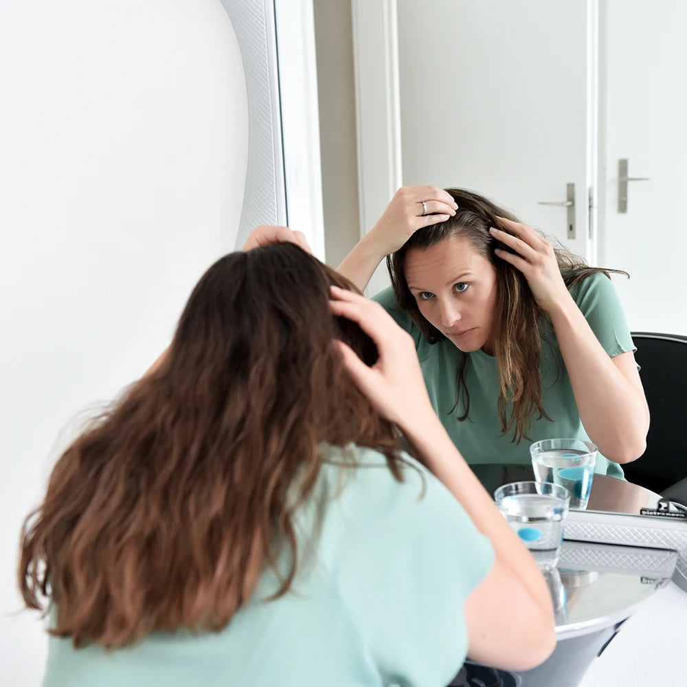 haarasufall frau mann spiegel kapseln nahrungsergänzungsmittel